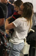 HILARY DUFF with Her Dog at LAX Airport in Los Angeles 04/12/2018