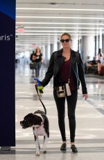 KATE UPTON and Her Dog at LAX Airport in Los Angeles 04/22/2018