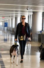KATE UPTON and Her Dog at LAX Airport in Los Angeles 04/22/2018