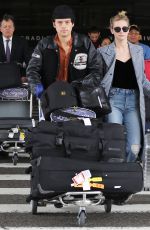 LILI REINHART and Cole Sprouse  at LAX Airport in Los Angeles 04/04/2018