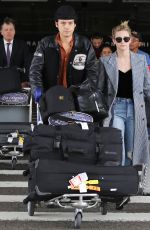 LILI REINHART and Cole Sprouse  at LAX Airport in Los Angeles 04/04/2018