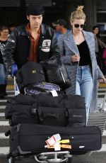 LILI REINHART and Cole Sprouse  at LAX Airport in Los Angeles 04/04/2018