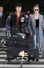 LILI REINHART and Cole Sprouse  at LAX Airport in Los Angeles 04/04/2018