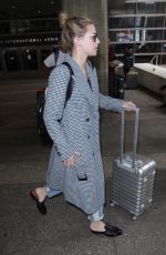 LILI REINHART and Cole Sprouse  at LAX Airport in Los Angeles 04/04/2018