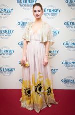 LILY JAMES at The Guernsey Literary and Potato Peel Pie Society Premiere in Guernsey 04/12/2018