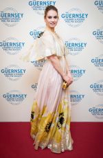 LILY JAMES at The Guernsey Literary and Potato Peel Pie Society Premiere in Guernsey 04/12/2018