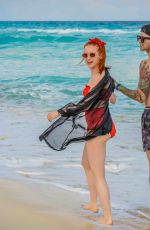 MADELAINE PETSCH and Travis Mills at a Beach in Cancun 04/18/2018