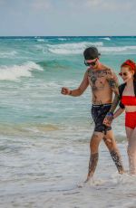 MADELAINE PETSCH and Travis Mills at a Beach in Cancun 04/18/2018