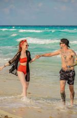 MADELAINE PETSCH and Travis Mills at a Beach in Cancun 04/18/2018