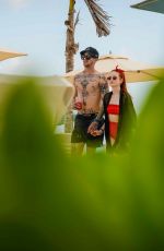 MADELAINE PETSCH and Travis Mills at a Beach in Cancun 04/18/2018