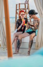 MADELAINE PETSCH and Travis Mills at a Beach in Cancun 04/18/2018