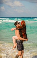 MADELAINE PETSCH and Travis Mills at a Beach in Cancun 04/18/2018