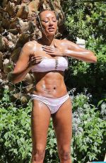MELANIE BROWN in Bikini at a Pool in Palm Springs 04/10/2018
