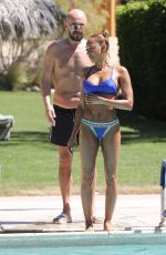 MELANIE BROWN in Bikini at a Pool in Palm Springs 04/15/2018