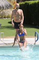 MELANIE BROWN in Bikini at a Pool in Palm Springs 04/15/2018