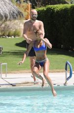 MELANIE BROWN in Bikini at a Pool in Palm Springs 04/15/2018