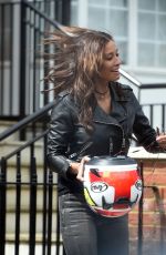 MELANIE SYKES Getting off Her Taxi Bike 04/26/2018
