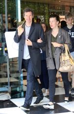 MILLA JOVOVICH and Paul W. S. Anderson Shopping at Prada Store in Beverly Hills 04/02/2018