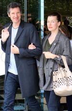 MILLA JOVOVICH and Paul W. S. Anderson Shopping at Prada Store in Beverly Hills 04/02/2018