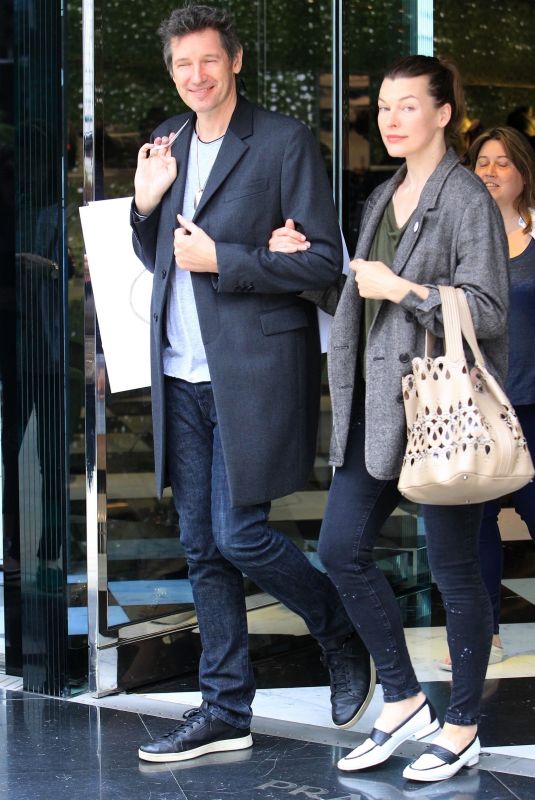 MILLA JOVOVICH and Paul W. S. Anderson Shopping at Prada Store in Beverly Hills 04/02/2018