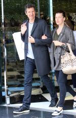 MILLA JOVOVICH and Paul W. S. Anderson Shopping at Prada Store in Beverly Hills 04/02/2018