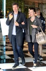 MILLA JOVOVICH and Paul W. S. Anderson Shopping at Prada Store in Beverly Hills 04/02/2018