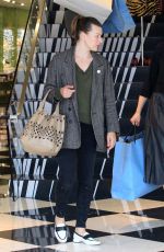 MILLA JOVOVICH and Paul W. S. Anderson Shopping at Prada Store in Beverly Hills 04/02/2018