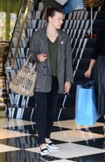 MILLA JOVOVICH and Paul W. S. Anderson Shopping at Prada Store in Beverly Hills 04/02/2018