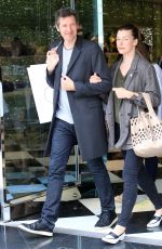MILLA JOVOVICH and Paul W. S. Anderson Shopping at Prada Store in Beverly Hills 04/02/2018