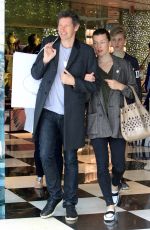 MILLA JOVOVICH and Paul W. S. Anderson Shopping at Prada Store in Beverly Hills 04/02/2018