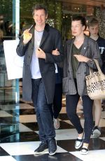 MILLA JOVOVICH and Paul W. S. Anderson Shopping at Prada Store in Beverly Hills 04/02/2018
