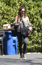 OLIVIA MUNN Carrying Her Dog in a Dog Pouch Out in Los Angeles 04/10/2018