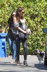 OLIVIA MUNN Carrying Her Dog in a Dog Pouch Out in Los Angeles 04/10/2018