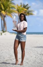 SLOANE STEPHENS Poses with Miami Open Championship Trophy at Crandon Beach 03/31/2018