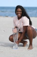 SLOANE STEPHENS Poses with Miami Open Championship Trophy at Crandon Beach 03/31/2018