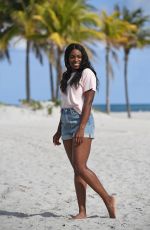 SLOANE STEPHENS Poses with Miami Open Championship Trophy at Crandon Beach 03/31/2018