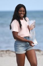 SLOANE STEPHENS Poses with Miami Open Championship Trophy at Crandon Beach 03/31/2018