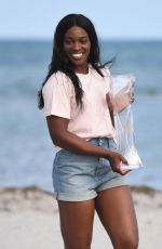SLOANE STEPHENS Poses with Miami Open Championship Trophy at Crandon Beach 03/31/2018