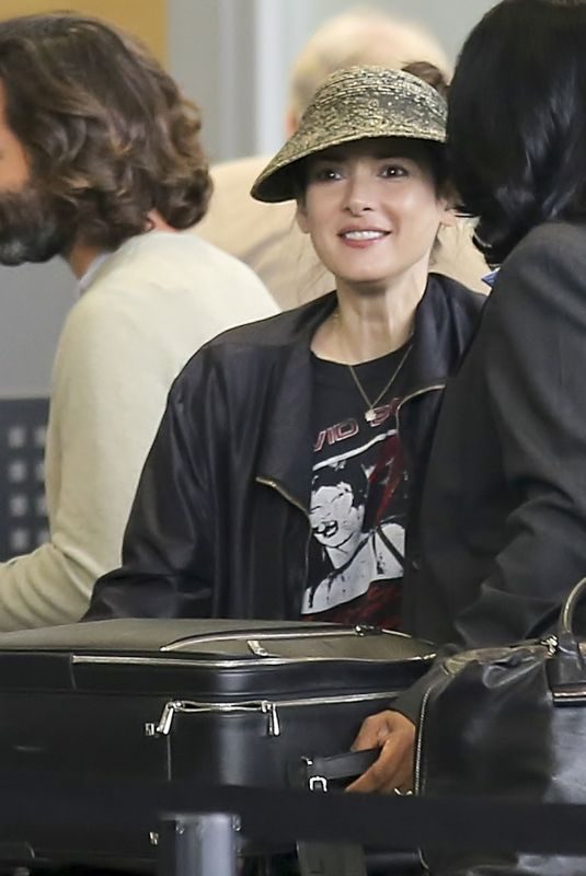 WINONA RYDER at LAX Airport in Los Angeles 04/15/2018