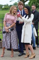 AMANDA HOLDEN Interviewing Harry and Meghan Lookalikes at Kensington Palace in London 05/16/2018