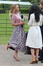 AMANDA HOLDEN Interviewing Harry and Meghan Lookalikes at Kensington Palace in London 05/16/2018