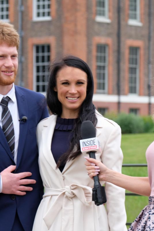 AMANDA HOLDEN Interviewing Harry and Meghan Lookalikes at Kensington Palace in London 05/16/2018