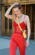 BELLA THORNE All in Red Leaves Her Hotel in New York 05/24/2018