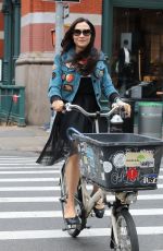 FAMKE JANSSEN Out Riding a Bike in New York 05/06/2018