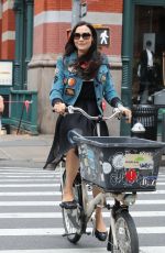 FAMKE JANSSEN Out Riding a Bike in New York 05/06/2018