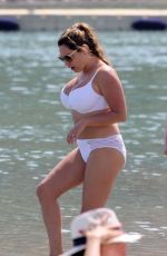 KELLY BROOK in White Bikini on the Beach in Mykonos 05/26/2018