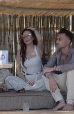 LINDSAY LOHAN at a Beach Bar in Mykonos 05/26/2018