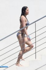 MICHELLE RODRIGUEZ in Bikini Swimming at Eden Roc Hotel in Antibes 05/17/2018