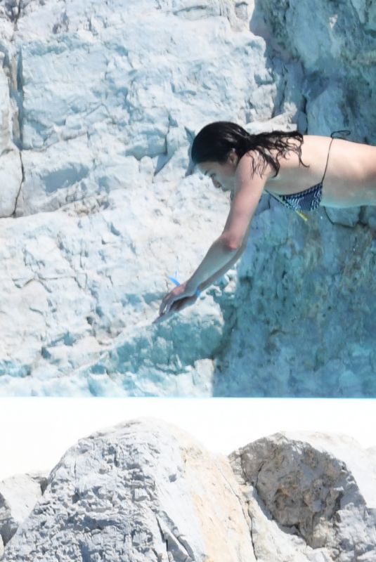 MICHELLE RODRIGUEZ in Bikini Swimming at Eden Roc Hotel in Antibes 05/17/2018