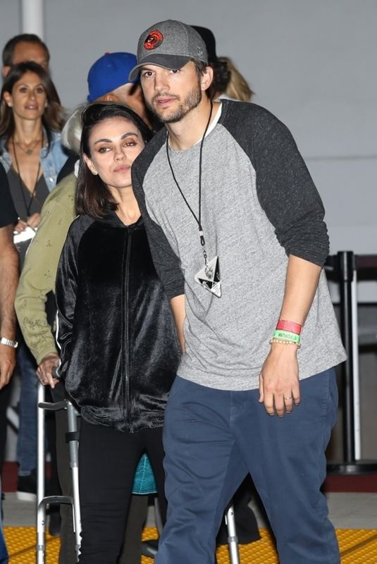 MILA KUNIS and Ashton Kutchner Arrives at U2 Concert in Inglewood 05/16/2018